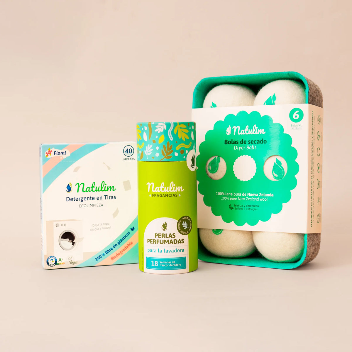 Perlas Bosque Aurora en tubo verde de hojas junto a la caja de tiras Floral de 40 lavados y las bolas de lana